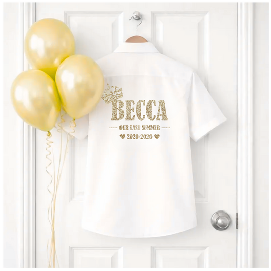 White t-shirt with 'BECCA' text and gold balloons on a white door background
