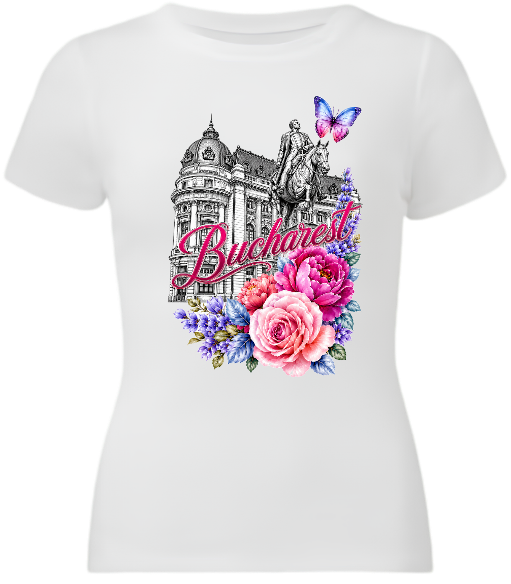 A white short-sleeve crewneck t-shirt featuring a colorful graphic print of the Budapest skyline, including the Buda Castle, a statue, a butterfly, and pink and purple flowers with the word 'Budapest' in script.