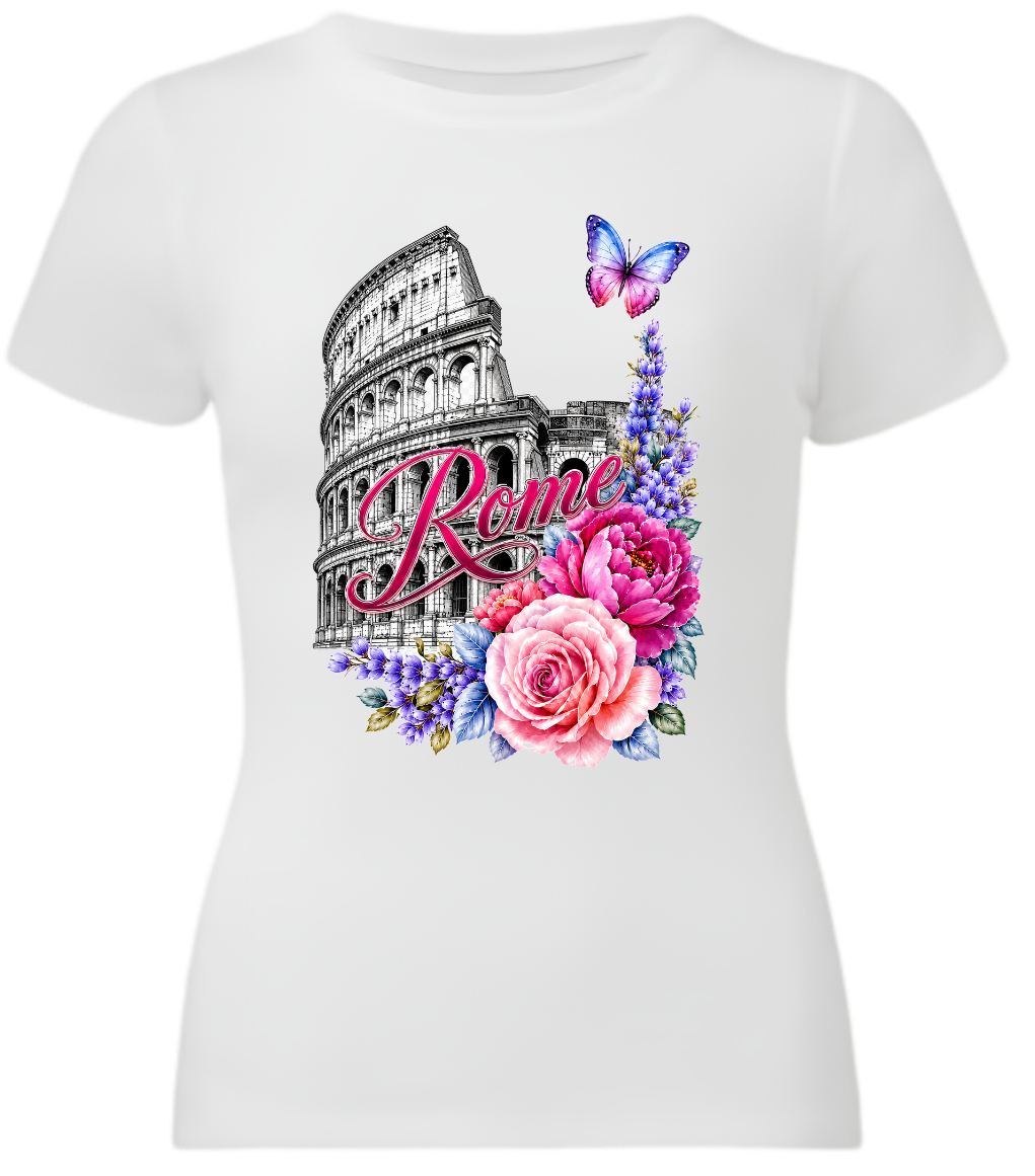 A white short-sleeve crewneck t-shirt featuring a colorful graphic print of the Colosseum in Rome, decorated with pink and purple flowers, a butterfly, and the word 'Rome' in script.