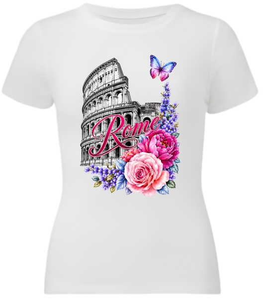A white short-sleeve crewneck t-shirt featuring a colorful graphic print of the Colosseum in Rome, decorated with pink and purple flowers, a butterfly, and the word 'Rome' in script.