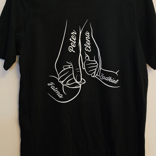 Black T-shirt with a design of white handprints holding hands, with custom names in place of fingers.