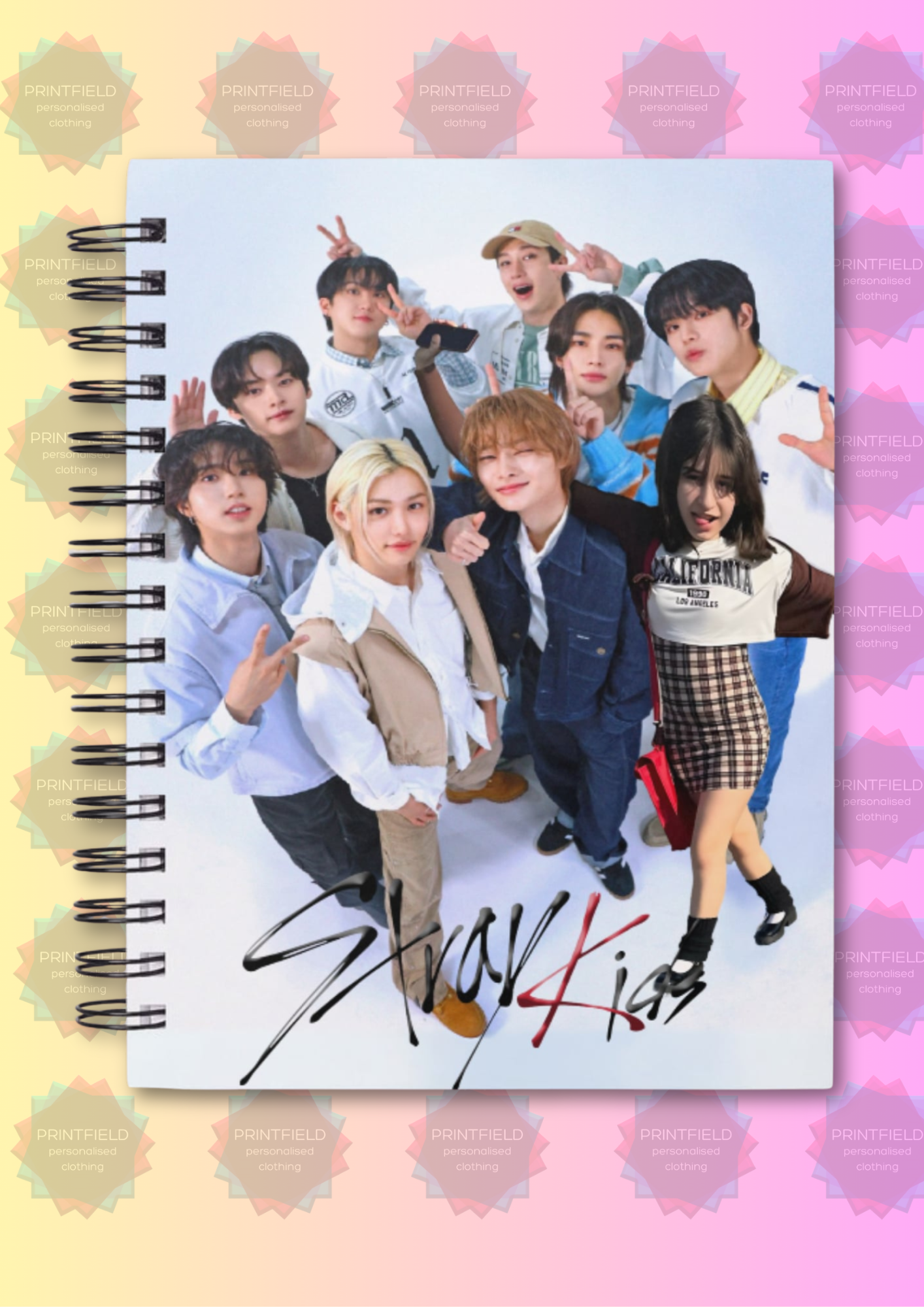 Notebook with a colorful design featuring a group of people on a pastel straykids group