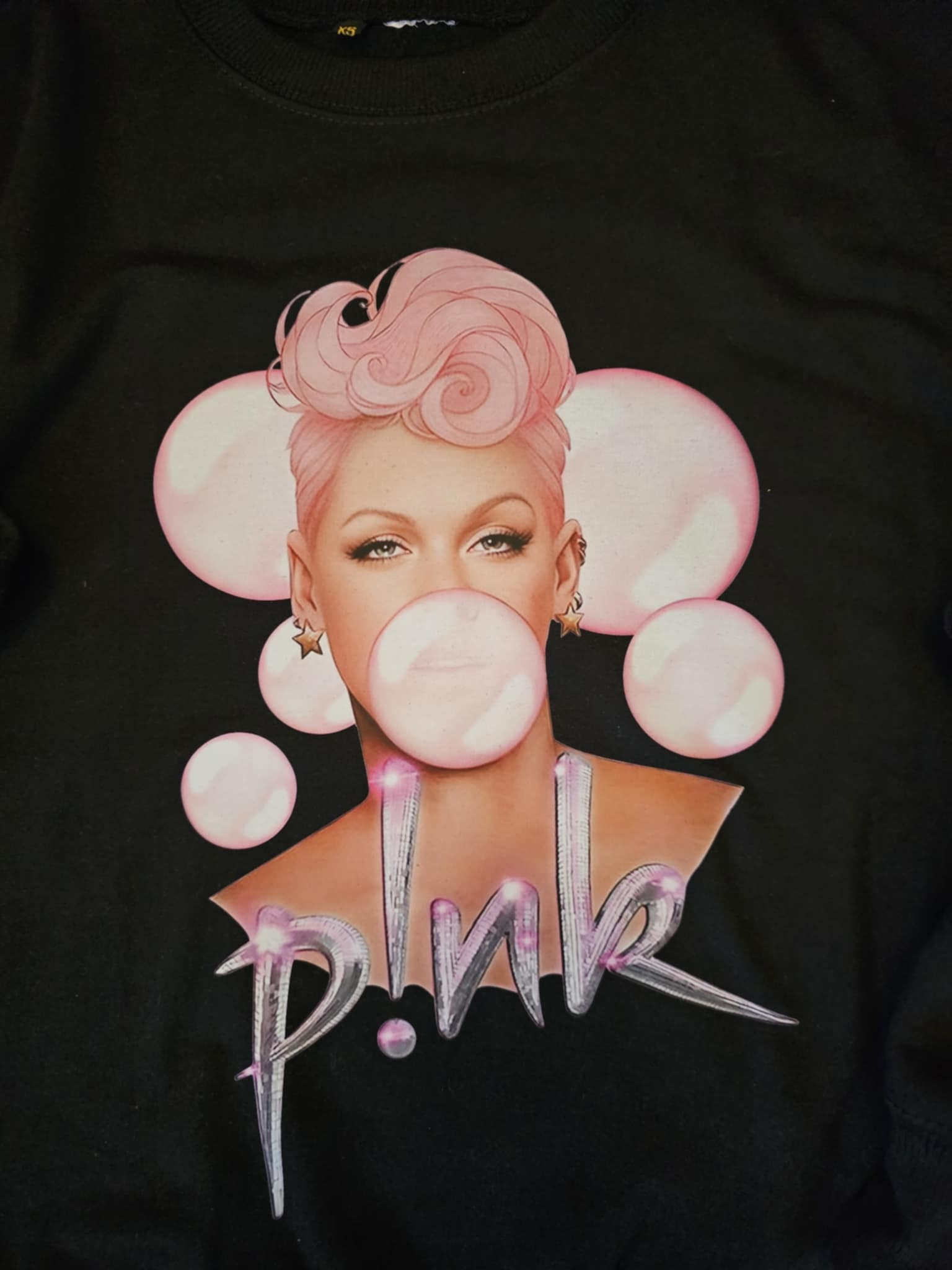 Close-up of Pink Bubblegum sweatshirt print detail showing texture and quality