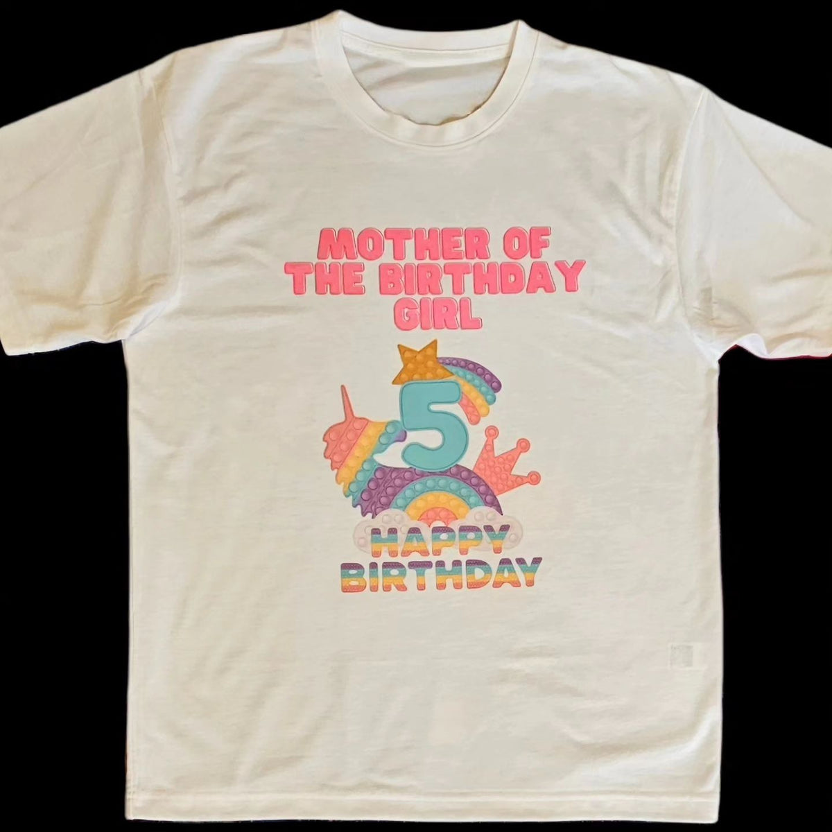 A white t-shirt with a colorful 'Pop It' design and text celebrating a birthday, featuring the number 5 and the phrase 'Mother of the Birthday Girl'.